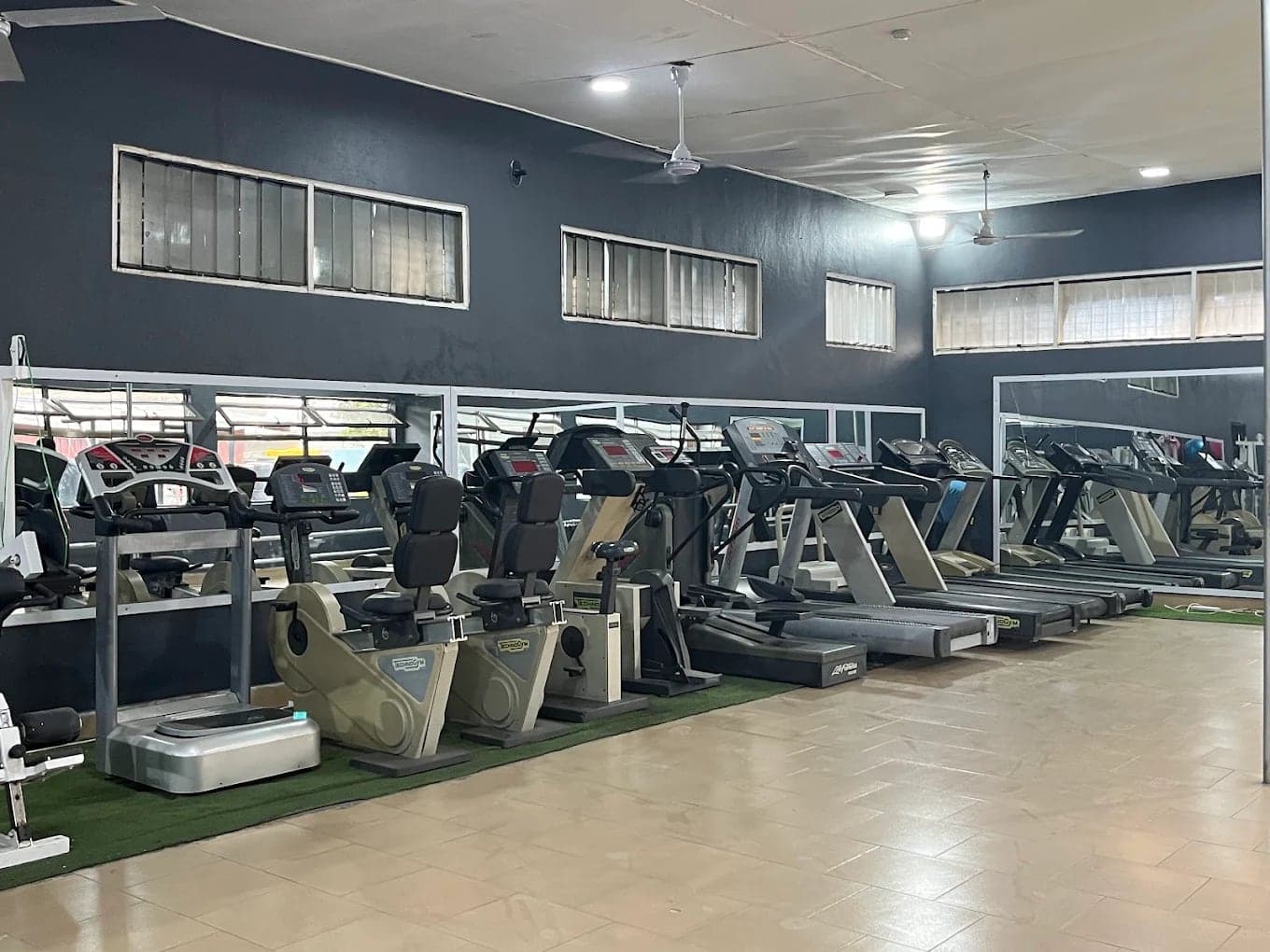 Treadmills, exercise bikes and cardio equipment on the gym floor